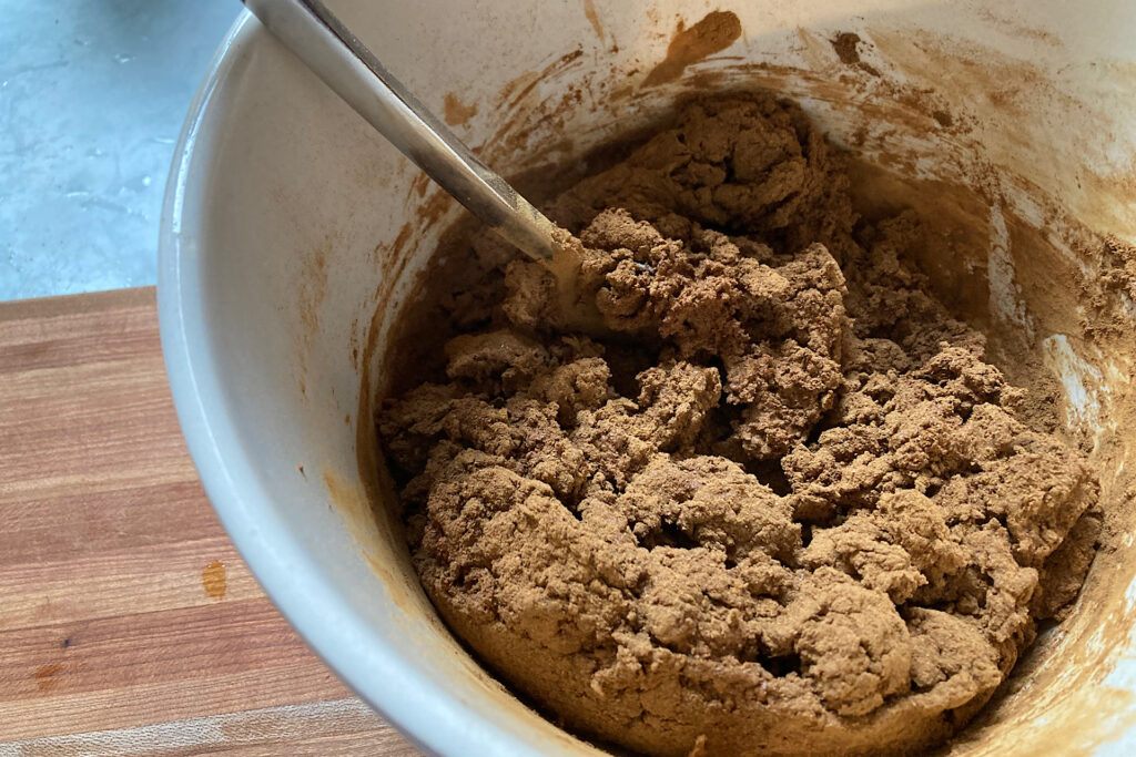 Mixing spices, glue and applesauce for ornaments