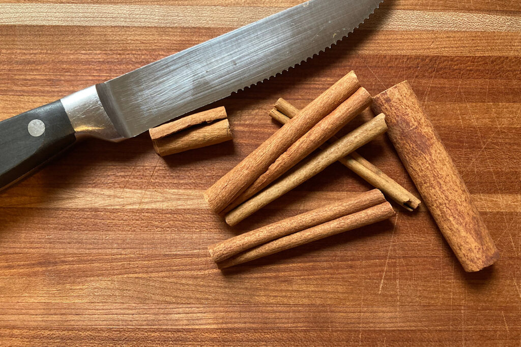 Cinnamon sticks, cutting board and knife