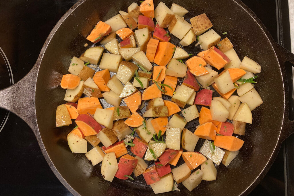 Seasoned potatoes in skillet