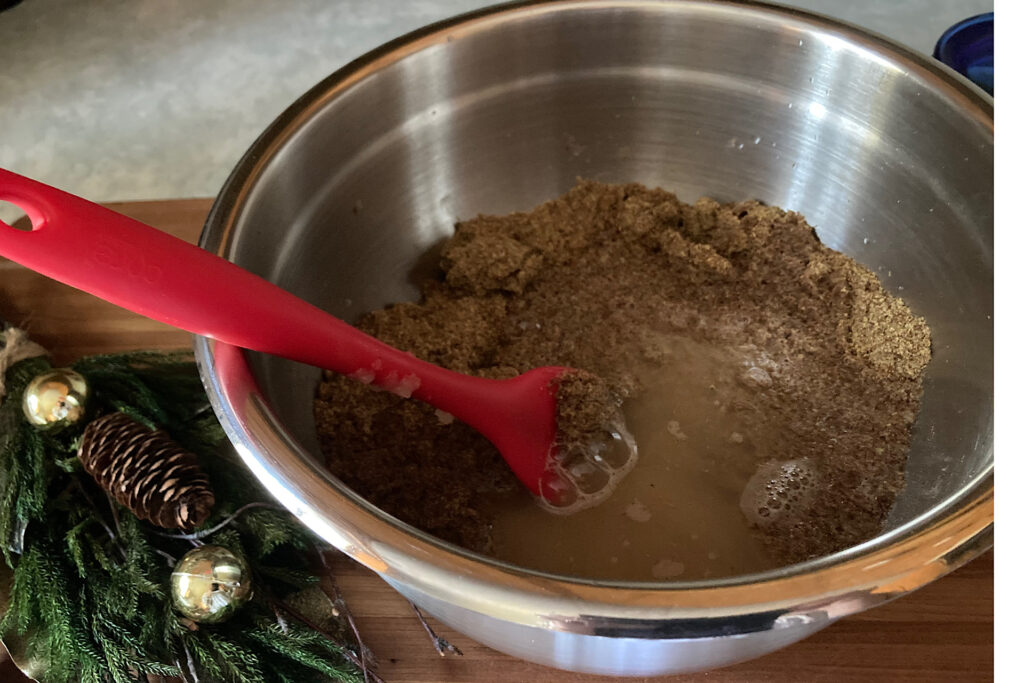 Stirring flax and spices in mixing bowl