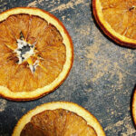 Stone-dried orange slices on pizza stone