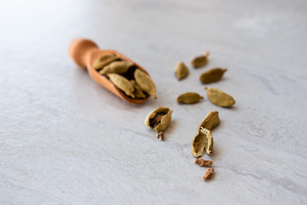 Scoop of cardamom seeds for Fragrance Simmer