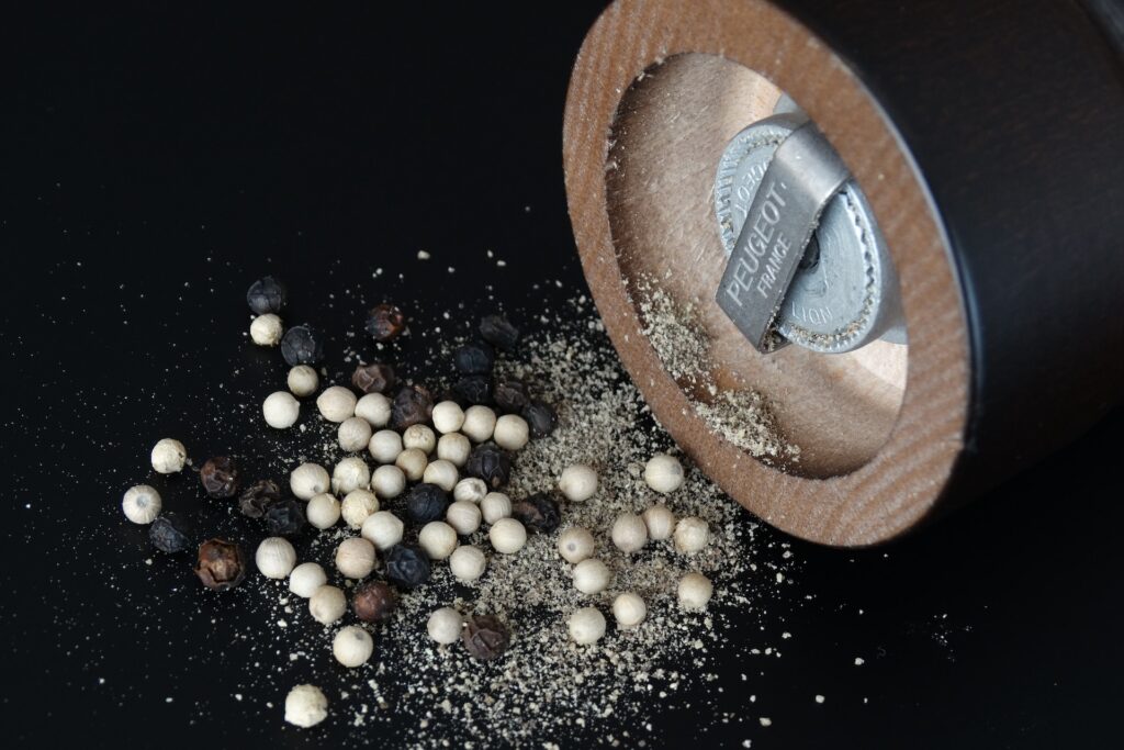 Pepper grinder and peppercorns