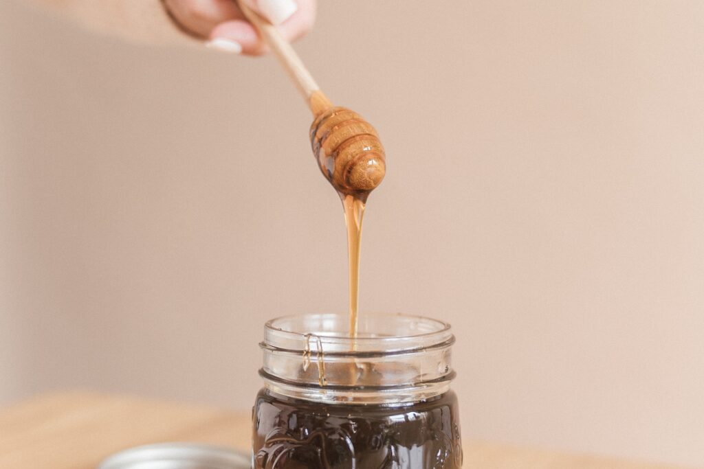 Honey Drizzling Into jar