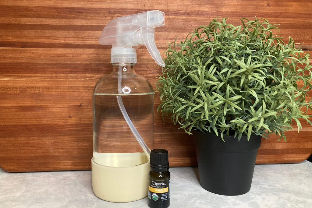 Grain alcohol sanitizing spray bottle essential oil and potted plant