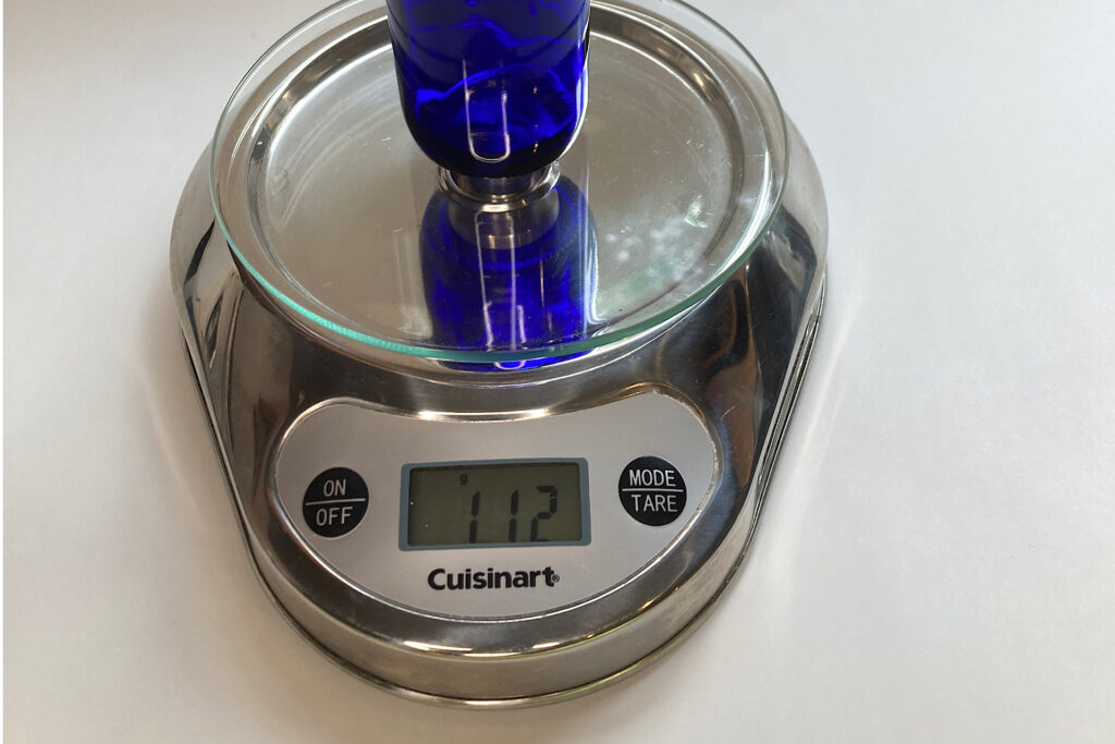 Weighing 4 oz. Blue Glass Bottle