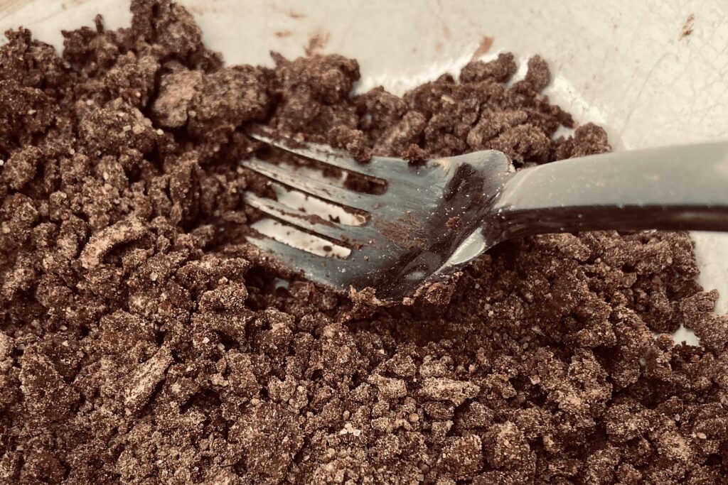 Mashing Crumble Mixture for Chocolate Rhubarb Muffins