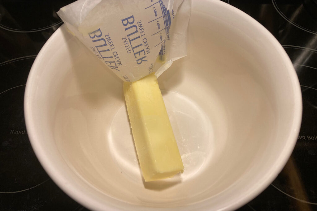 Softened Butter in White Mixing Bowl