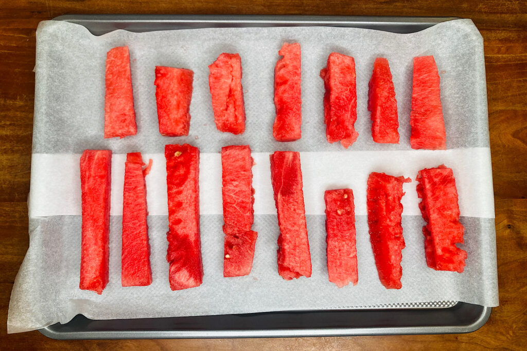 Watermelon logs on Parchment-Lined Baking Sheet