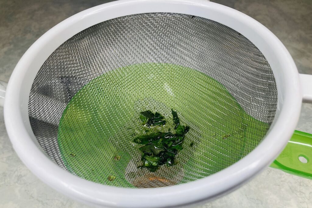 Sieve with Honey Basil Lime and Mint Syrup