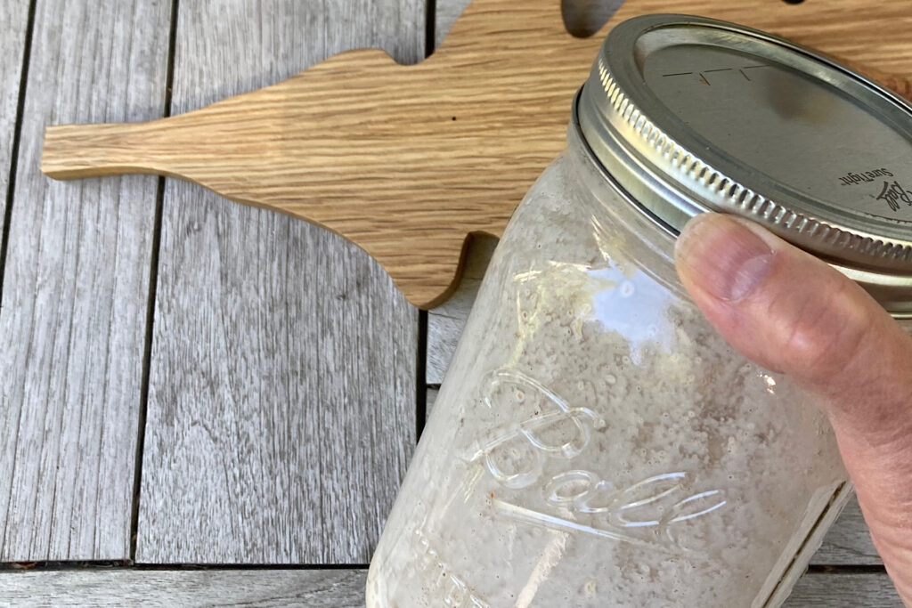 Shaking Pumpkin Spice Half and Half in Mason Jar