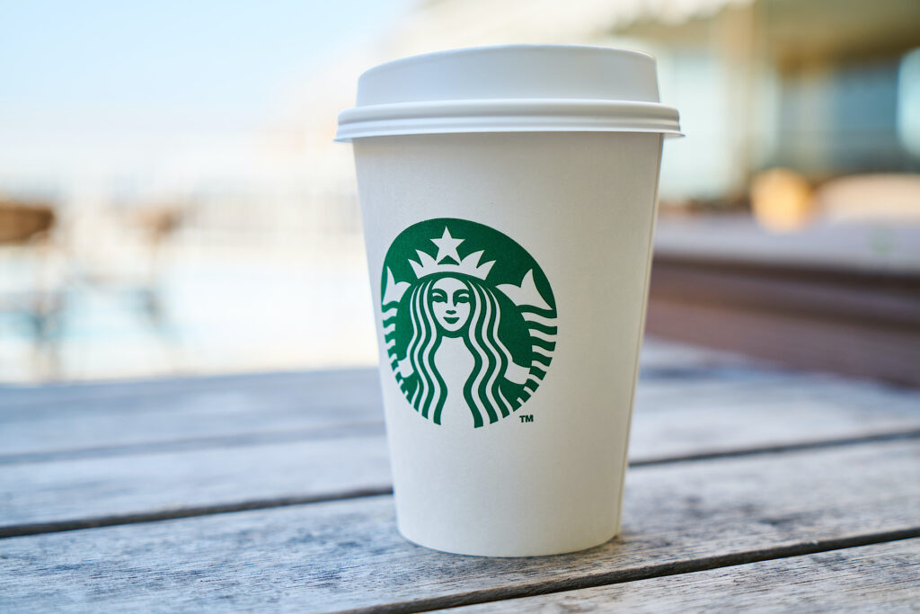 Starbucks Paper Coffee Cup on Wooden Table