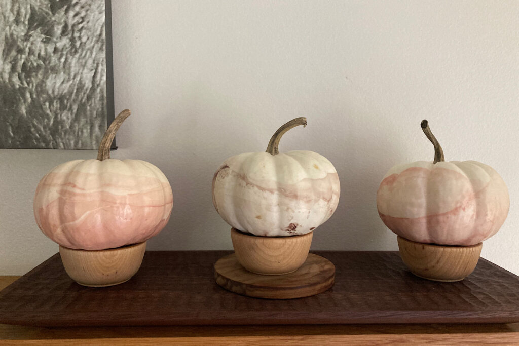 Nail-Enamel Pumpkins on fireplace mantel.