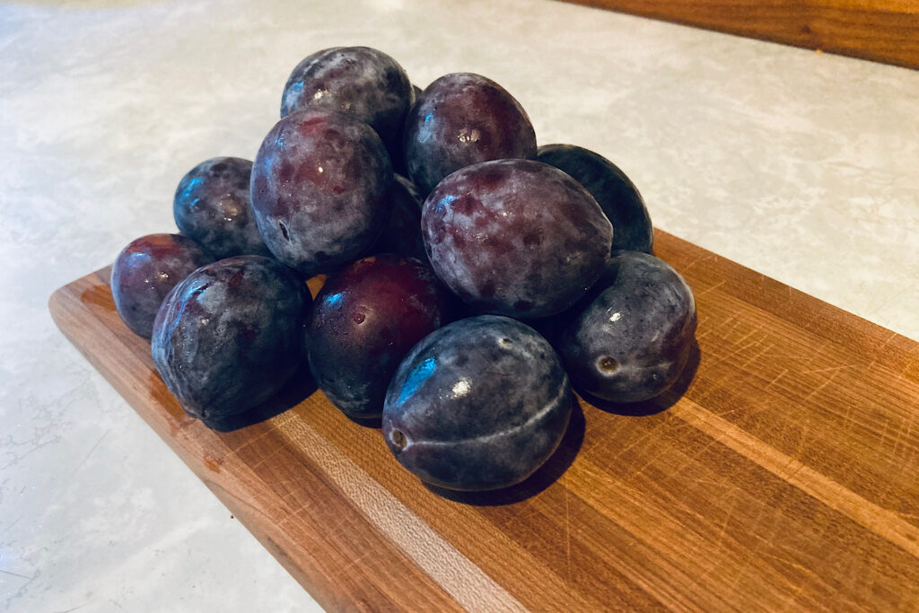 Ripe plums for seasonal tart
