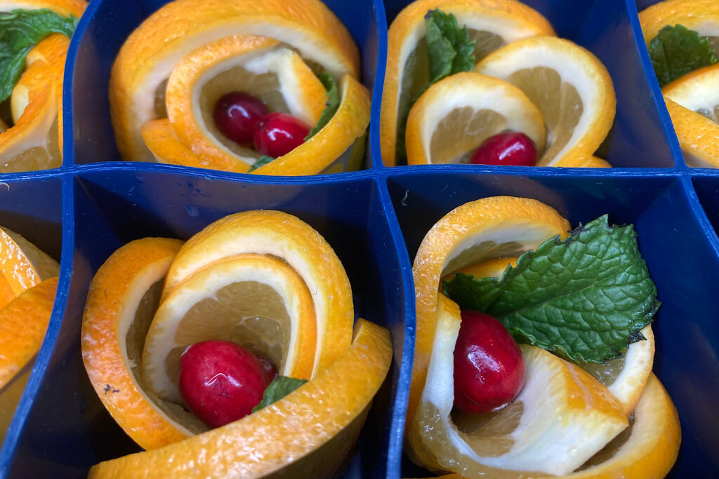 Closeup of Oranges, Cranberries and Mint in Ice Cube Trays