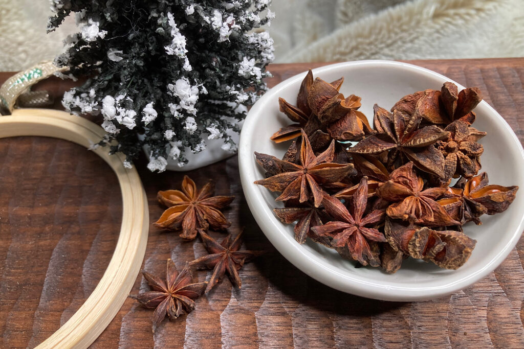 Star Anise in Bowl with Small Embroidery Hoop and Christmas Tree