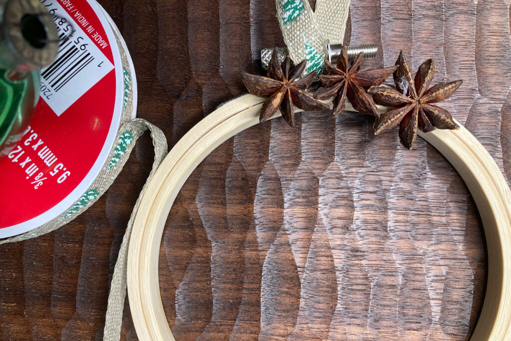 3 Anise Stars Glued on Top of Embroidery Hoop