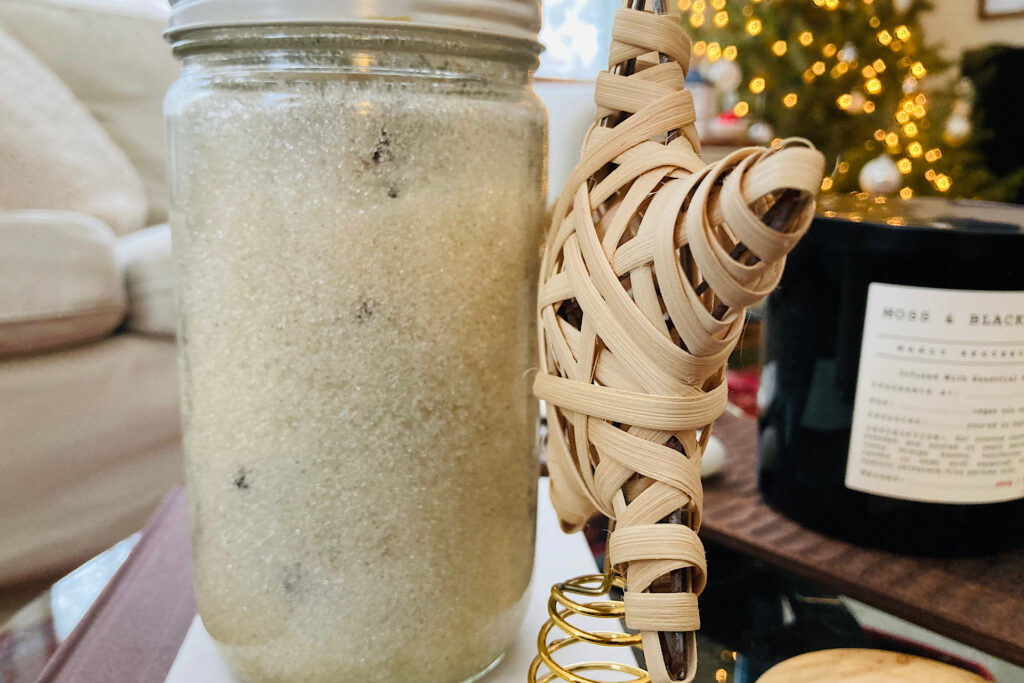 Homemade Vanilla Sugar in Jar next to Rattan Christmas Tree Star