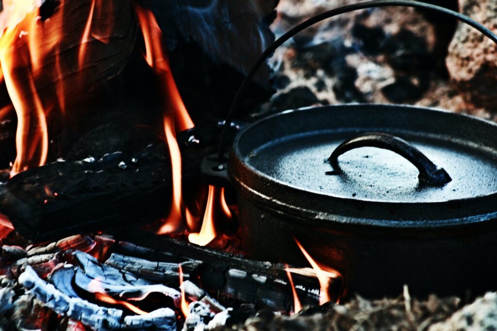 cast iron dutch oven in wood fire