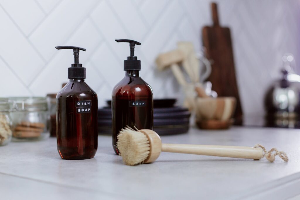 dish soap and scrub brush on countertop