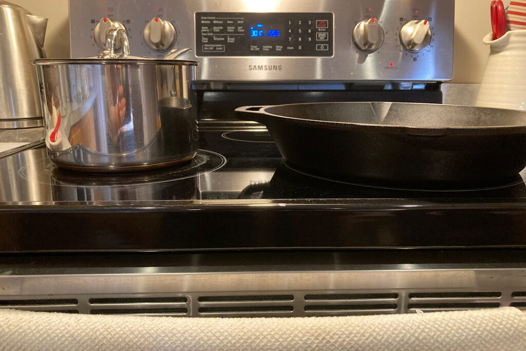 Cast iron skillet on glass top stove