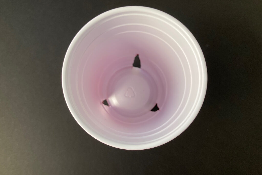 3 triangles cut in bottom of solo cup for seed planting