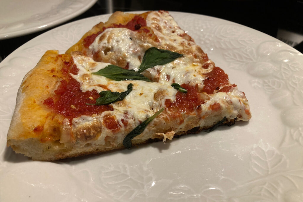 Crispy Crust Cast Iron Pizza slices on white plate