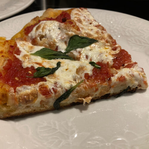 Crispy Crust Cast Iron Pizza slices on white plate