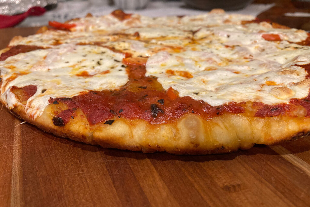 crispy crust cast iron pizza on cutting board