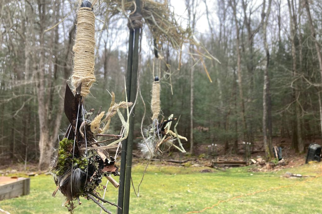 whisk with nesting materials hung outdoors