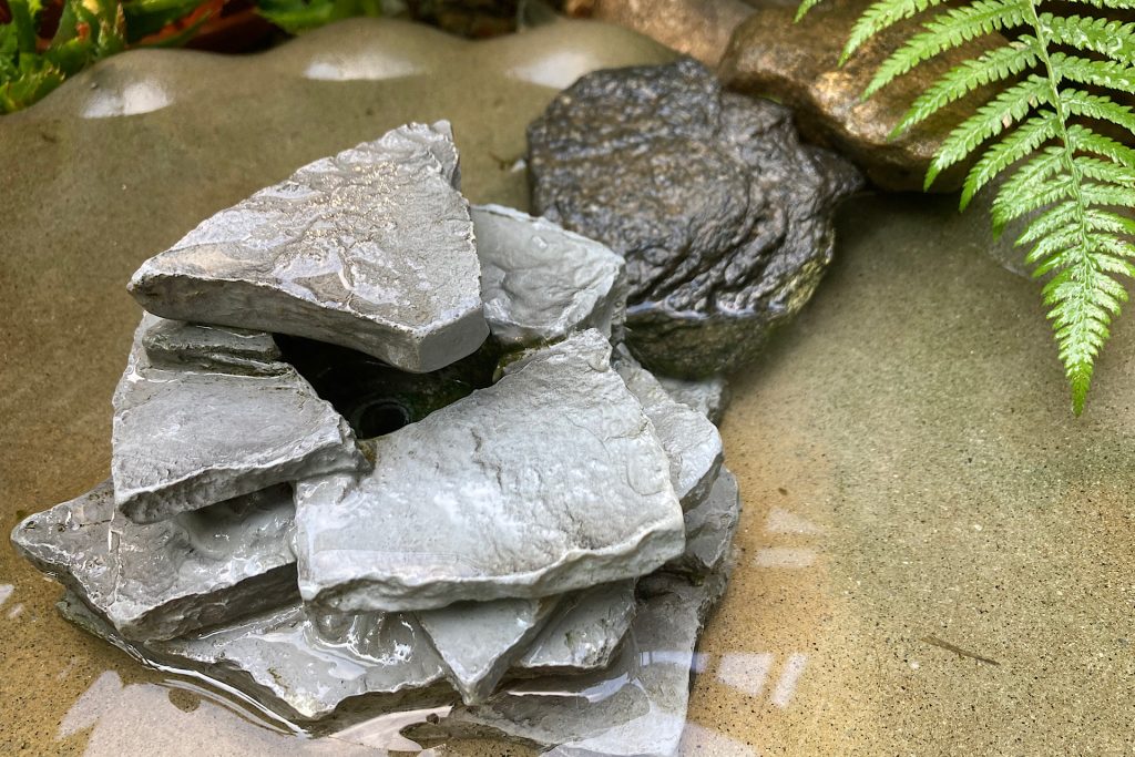 placing rocks over fountain cord