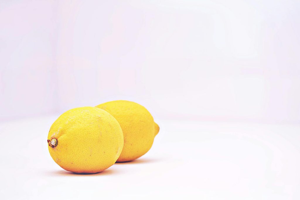 two lemons on white background