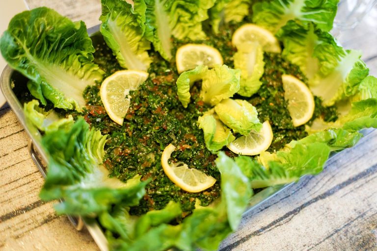tabouli salad with lettuce leaves and lemons