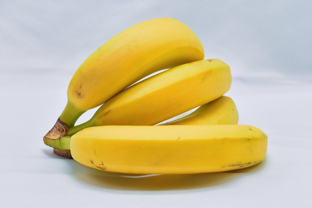 ripe bananas on white countertop