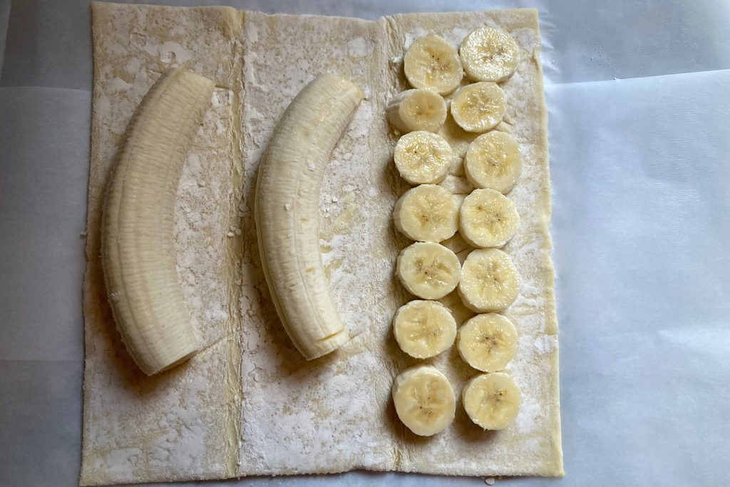 bananas and slices laid out on puff pastry sheet