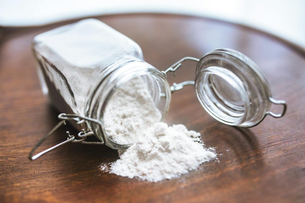 corn starch spilling out of glass jar