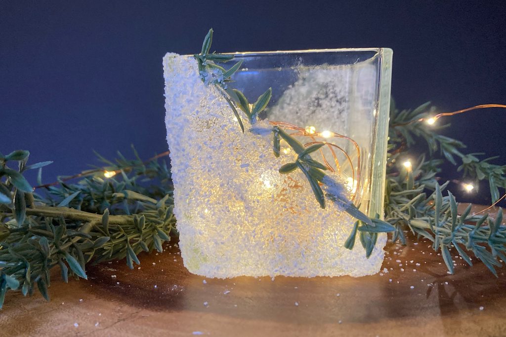 Frosted epsom salt candle jar with greenery snippets