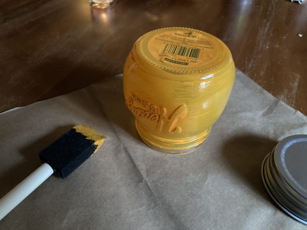 First coat of chalk paint drying on pumpkin lantern