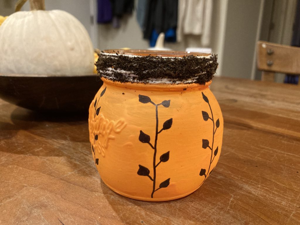 Soil pressed into Mod Podge on Pumpkin Lantern