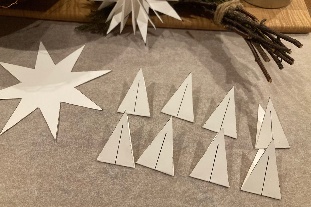 folded white cardstock star points