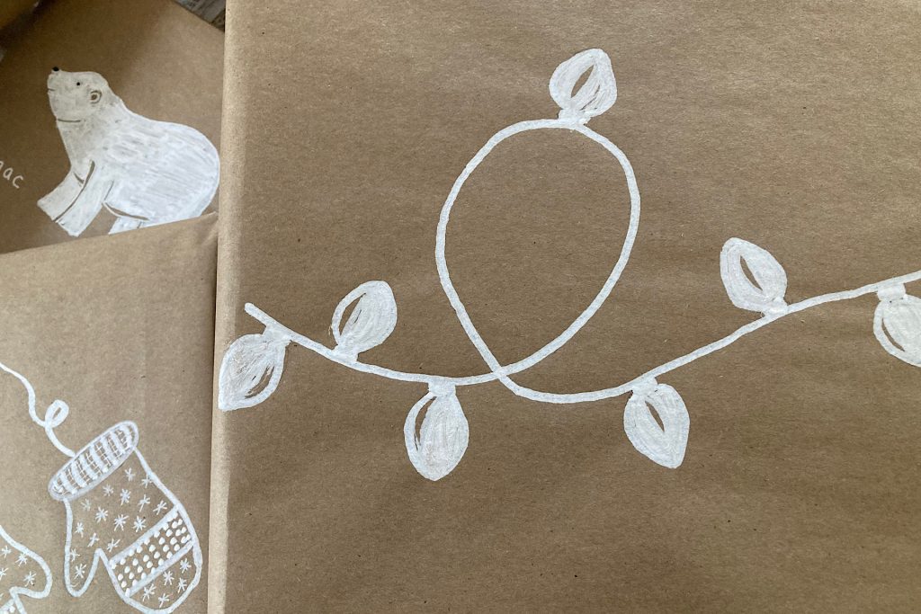 drawing light string on gift wrap