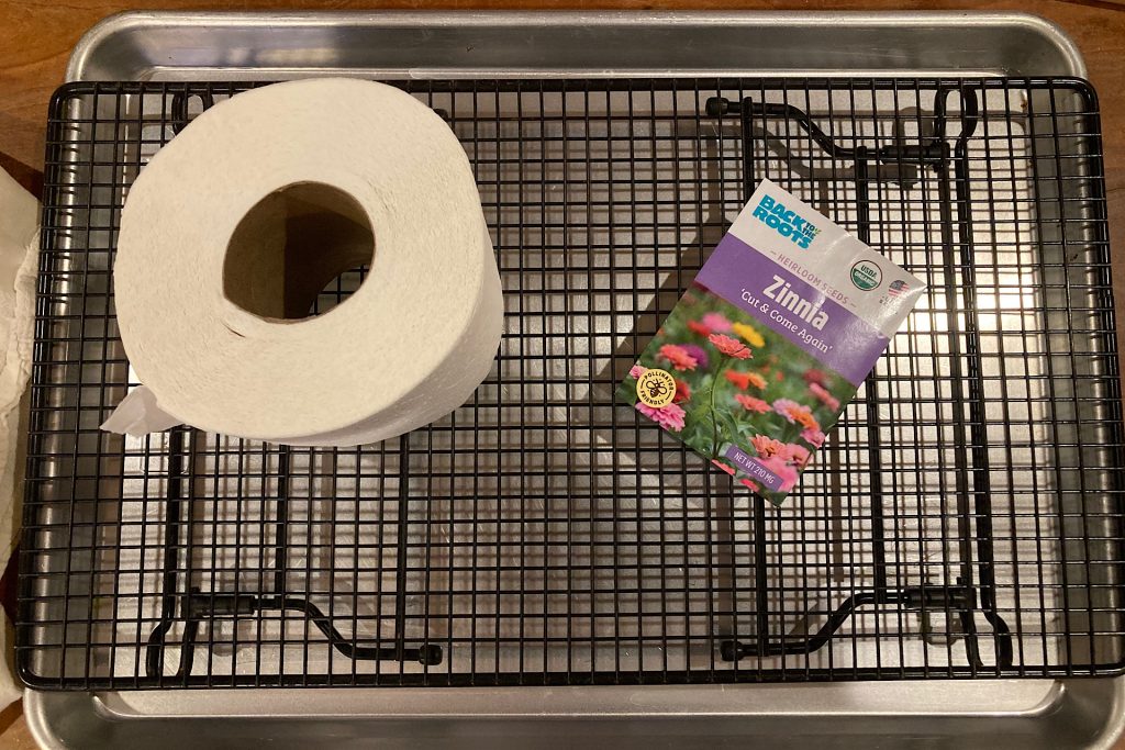 seed packet and roll of paper on baking rack