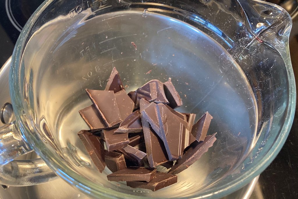 chopped chocolate beginning to melt in double boiler