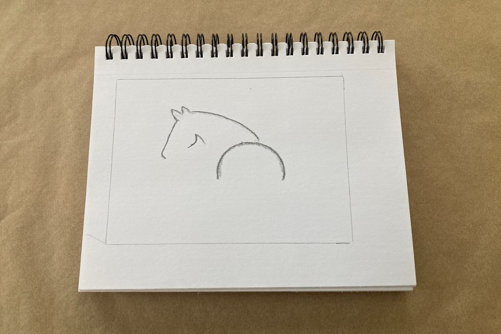 tracing around horse artwork with glass from frame
