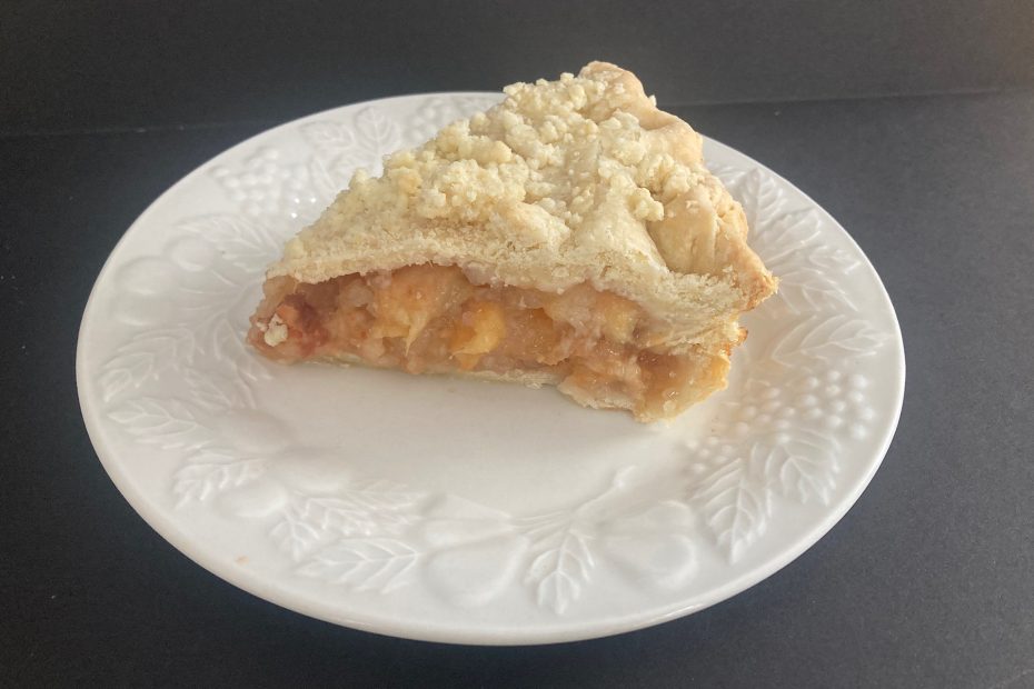 slice of pie from grandmother's peach pie recipe
