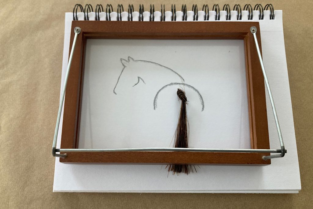 frame set on top of horse artwork for centering