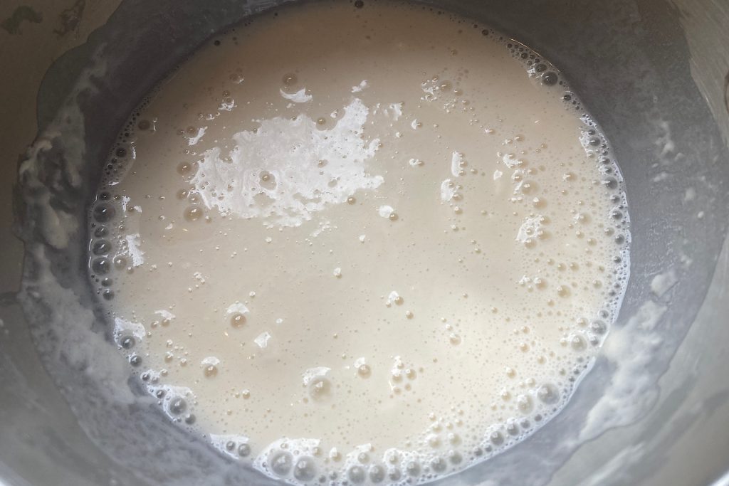 closeup up of flour and water mixture in small metal bowl