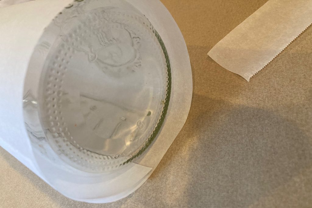 Parchment paper wrapped loosely around canning jar