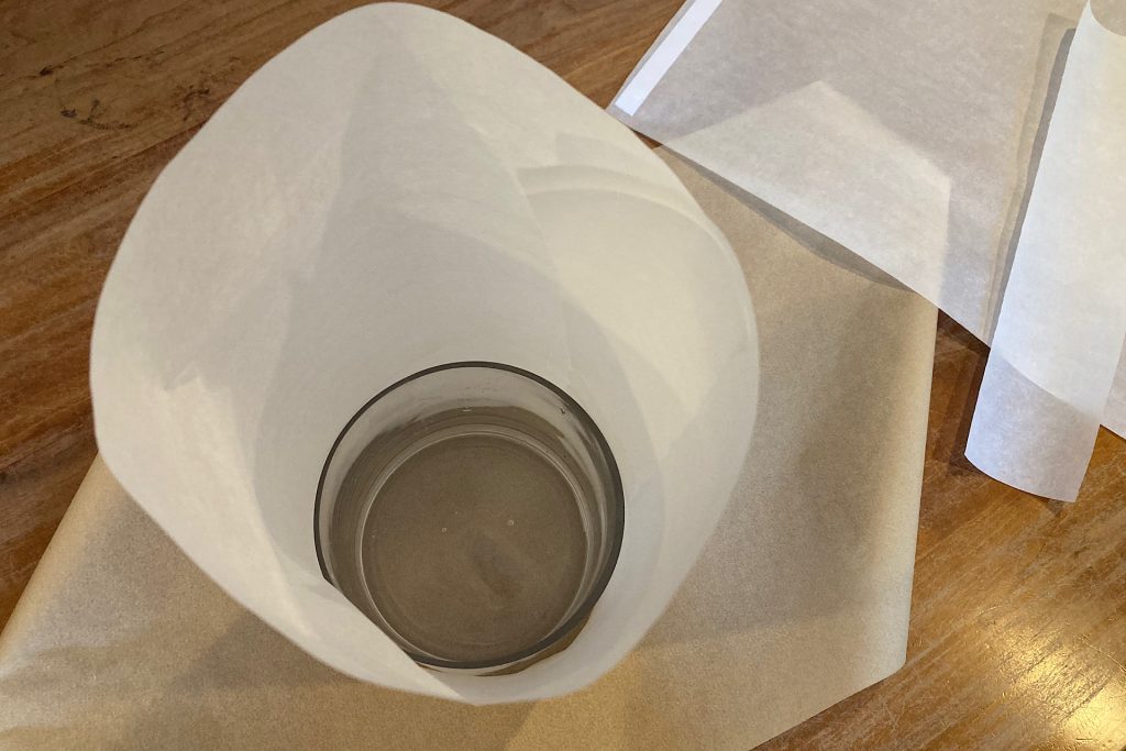 Parchment paper wrapped taped around mason jar