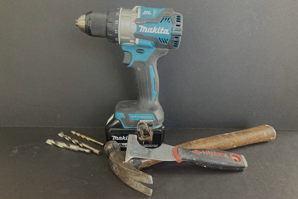 hand drill, bits, hammer and putty knife